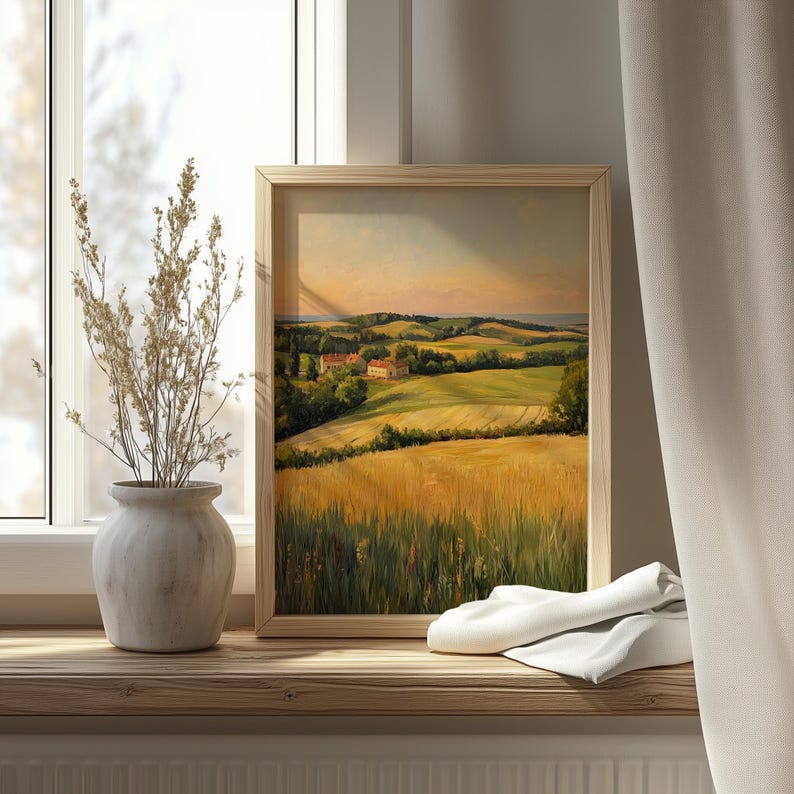 Tranquil landscape printable wall art for family room — peaceful patchwork fields and a quaint farmhouse under a soft, glowing sky.