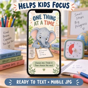 May include: A smartphone screen displaying a digital illustration of a gray elephant writing on a notepad with the text One Thing At A Time. The screen includes the text Choose one. Finish it. Then choose the next. and features a stack of books.