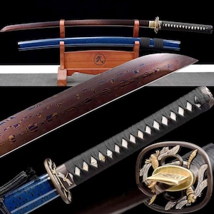 May include: A detailed image of two Japanese katana swords. One sword has a brown blade and handle, the other has a blue scabbard. The blades have intricate patterns. The swords are displayed on a wooden stand.