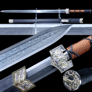 May include: A detailed image of a traditional sword with a silver blade and intricate metalwork. The handle is wrapped in brown cord, and the scabbard is black. The sword features ornate designs and is displayed on a clear stand.