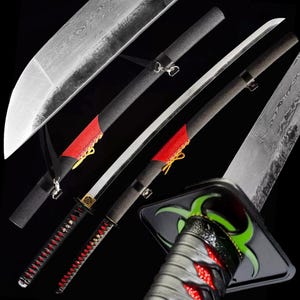 May include: Several Japanese-style swords with curved blades and black handles are displayed against a dark background. The swords feature red accents, decorative elements, and sheaths. The blades have a distinctive pattern.