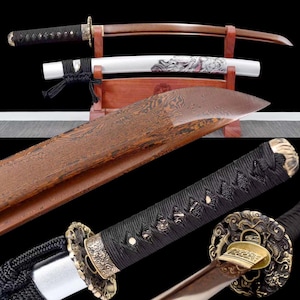 May include: An assortment of Japanese katana swords. The blades have a brown and silver finish, with intricate designs on the handles and sheaths. The handles are wrapped in black cord, and the blades are displayed on a wooden stand.