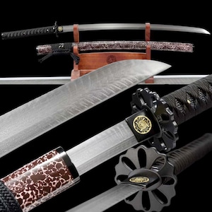 May include: An assortment of Japanese katana swords. The blades are silver with intricate patterns. The handles are black with decorative accents. One sword is in a wooden stand, and another is in a decorative sheath.