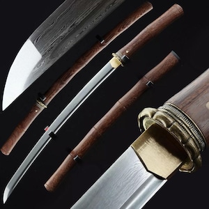 May include: A white ceramic mug with a black handle and the text "But First, Coffee" in a black, handwritten-style font. The mug is on a white surface.