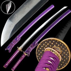 May include: A Japanese katana sword with a silver blade and a purple handle. The handle is wrapped in purple fabric and has gold accents. The sword's guard is a dark brown color with gold detailing. The blade has a visible pattern.