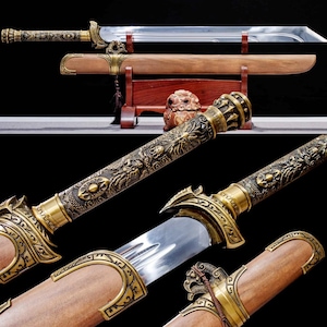 May include: An ornate sword with a polished steel blade and a wooden scabbard. The hilt and scabbard fittings are detailed with bronze-colored dragon and floral designs. The sword rests on a wooden stand, showcasing its craftsmanship.