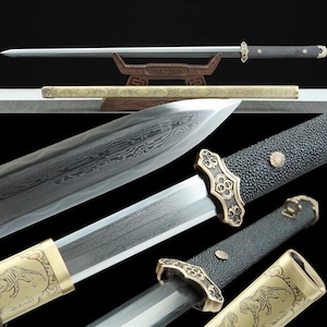 May include: A detailed image of a traditional sword with a silver blade and a black handle. The sword is displayed with its scabbard, which has a gold tiger design. The blade has a unique pattern. The sword is a symbol of martial arts.