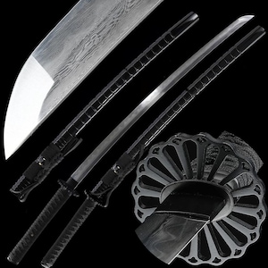 May include: An assortment of Japanese swords, featuring a curved blade and intricate handle designs. The blades have a silver finish with a detailed pattern, and the handles are black. The image showcases the swords' craftsmanship and traditional aesthetic.