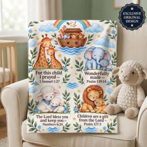 May include: A white fleece blanket featuring colourful illustrations of Noah's ark, giraffes, elephants, lambs, and a lion with their young. The blanket includes the text: For this child I prayed - 1 Samuel 1:27, Wonderfully made - Psalm 139:14, The Lord bless you and keep you - Numbers 6:24, and Children are a gift from the Lord - Psalm 127:3.