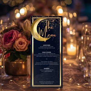May include: A navy blue menu card with gold accents and the words "The Menu" in elegant script. The menu lists appetizers, main courses, and dessert options. The card is set on a table with glasses, flowers, and candles.