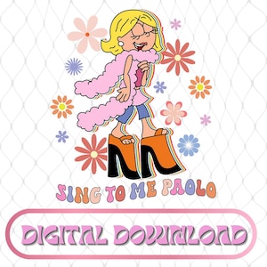 May include: A white ceramic mug with a black handle and the text "But First, Coffee" in a bold, black font. The mug is set against a blurred background, suggesting a cozy setting.