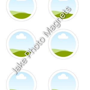 May include: Six circular magnets arranged in two columns, each featuring a graphic of a light blue sky with a single white cloud above rolling green hills. The text Jake Photo Magnets is printed diagonally across the centre of the image.