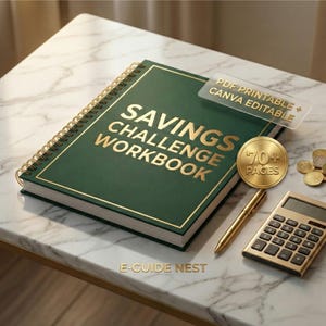May include: A green spiral-bound "Savings Challenge Workbook" with gold lettering and a gold border. A gold pen, calculator, and a coin are next to the workbook. The workbook has a clear sticker that says "PDF Printable + Canva Editable".