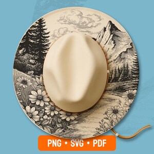 May include: A cream-colored cowboy hat with a landscape design. The brim features a black and white illustration of mountains, trees, and flowers. The hat has a brown leather band and a chin strap. The image also includes the text "PNG • SVG • PDF".