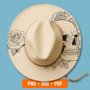 Peut inclure: Chapeau fedora crème avec un bandeau et une mentonnière en cuir marron. Le chapeau présente un motif de crâne et de roses noir et blanc sur le bord. Le chapeau porte le texte "PNG • SVG • PDF" en bas.
