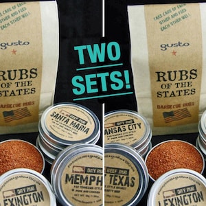 May include: Two sets of barbecue rubs are displayed. Each set includes a paper bag with "Rubs of the States" and several metal tins of dry rub. The tins are labeled with various city names and rub types.