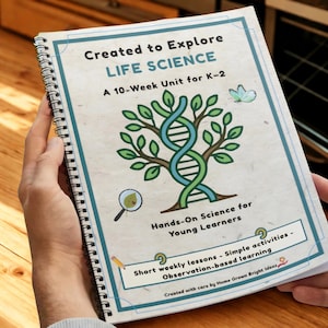 May include: A spiral-bound educational workbook titled Created to Explore LIFE SCIENCE A 10-Week Unit for K-2. The cover features a tree with a DNA strand trunk, a magnifying glass, a butterfly, and text about hands-on science for young learners.