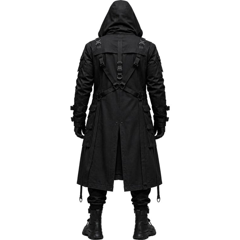 May include: A black hooded long coat featuring multiple utility pockets, adjustable straps with plastic buckles across the back, and a central vertical strap system. The garment includes long sleeves with buckled cuffs, a rear vent, and a structured design.