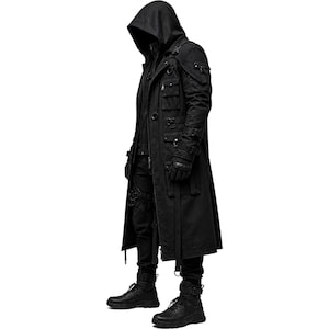May include: A black hooded long coat featuring multiple utility pockets, adjustable straps with buckles, metal D-rings, and a front zipper closure. The garment is paired with black trousers, black gloves, and black boots, creating a cohesive dark ensemble.