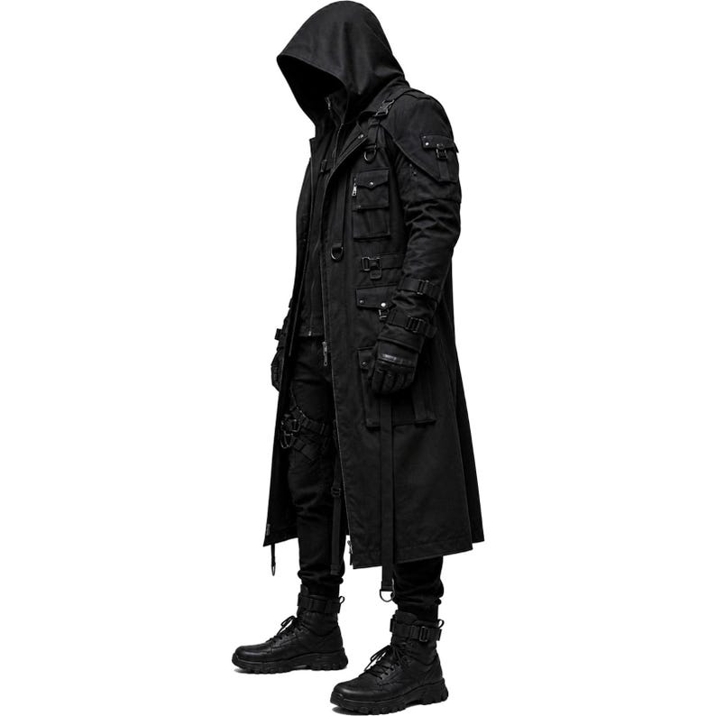 May include: A black hooded long coat featuring multiple utility pockets, adjustable straps with buckles, metal D-rings, and a front zipper closure. The garment is paired with black trousers, black gloves, and black boots, creating a cohesive dark ensemble.