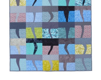 Twister quilt pattern by Flying Parrot Quilts, a pieced lap quilt, a fun way to try your hand at improvisational piecing in a modern design!