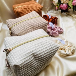 May include: A handmade wooden sign with the text "Welcome to our home" in a handwritten style. The sign is painted white with a distressed finish and a dark brown border. It is designed for indoor or outdoor use.