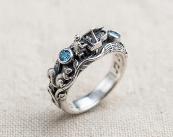 Art Nouveau Piano Ring in Silver with Blue Stones and Music Note Details