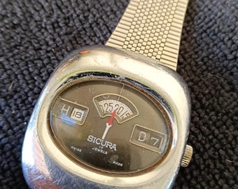 Orologio digitale meccanico Sicura Jump Hour vintage anni '70 – Swiss Made Retro-Futurismo