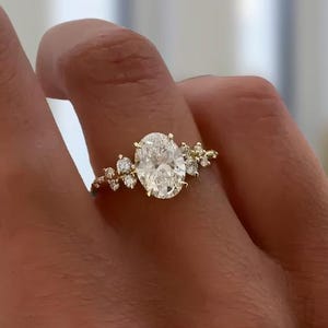 Oval Diamond Ring with nature inspired floral accents.