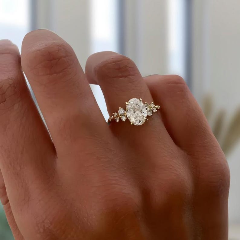 Oval Diamond Ring with nature inspired floral accents.