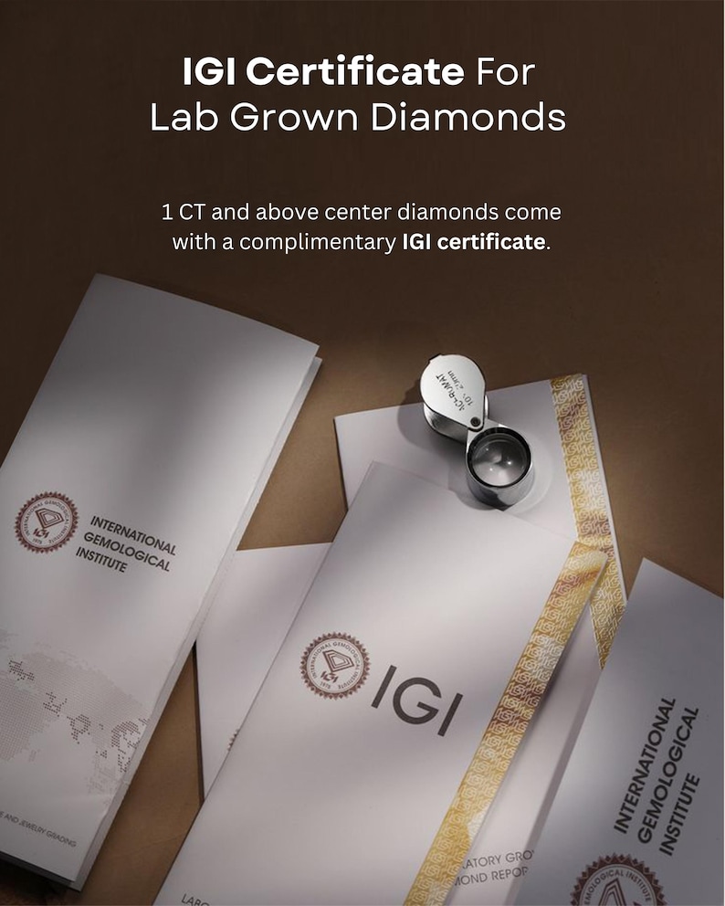 May include: White IGI certificates for lab grown diamonds with the text IGI Certificate For Lab Grown Diamonds and 1 CT and above center diamonds come with a complimentary IGI certificate. A silver jeweler's loupe rests on the documents.