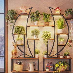 May include: Two matching black metal and wood plant shelves with various potted plants. The shelves have a unique circular design with built-in lighting. Decorative items include a snow globe, a small house, and a deer figurine. The shelves are on wheels.