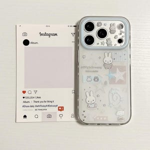 May include: Clear phone case with a light blue border, featuring cartoon bunny illustrations and the text "Miffy's Dreamy Moments." A paper Instagram post is to the left, with text and icons.