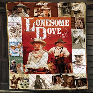 May include: A quilted blanket featuring imagery from the television series "Lonesome Dove." The design includes portraits of actors, the show's title in large white letters, and quotes. The color palette is dominated by red, brown, and white.
