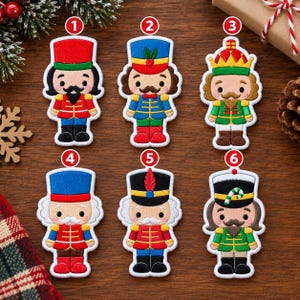 May include: Six embroidered nutcracker patches arranged in two rows, numbered one through six. Each figure features a distinct uniform color scheme, including red, blue, green, and black, with detailed facial features and hats, all with white borders.