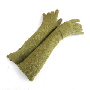 May include: A pair of long, olive green fingerless gloves made of knitted fabric.