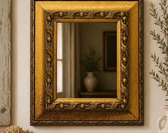 Vintage Gold Toned Wooden Mirror with Molded Accents on Frame