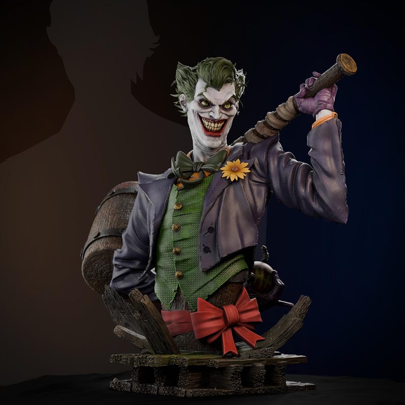 May include: A detailed bust of the Joker, featuring green hair, a white face with a sinister grin, and a purple jacket over a green vest. He holds a prop and is adorned with a bow tie and a yellow flower. The base includes a red bow.