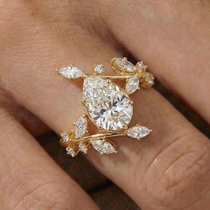 Verlovingsring met peervormige diamant en marquise geslepen zijstenen – Designerring met bloemmotief in 14K/18K goud