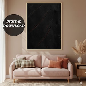 May include: A framed digital art print with a dark, textured abstract design and reddish-brown streaks. The artwork hangs above a pink sofa with cushions. The text "DIGITAL DOWNLOAD" is in a black circle in the upper left corner.
