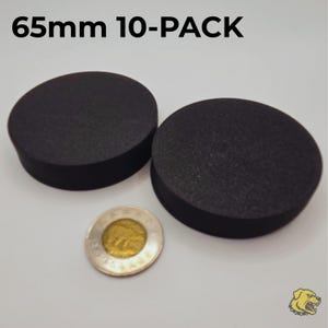 May include: A 10-pack of black circular discs, each measuring 65mm in diameter. The discs have a matte, textured surface and are shown alongside a Canadian two-dollar coin for scale. The text 65mm 10-PACK is printed at the top of the image.