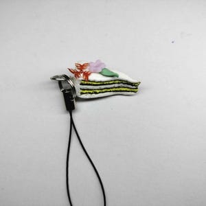 Decorative cake accessory with Phone string loop.