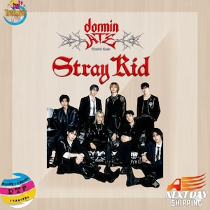 May include: A promotional image with the text "domin" and "Stray Kid" in red, featuring a group of nine people in black outfits. The image includes the text "World Tour" and logos for "Transfer DTF" and "Next Day Shipping".