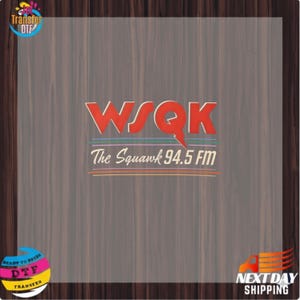 May include: A graphic with the text "WSQK The Squawk 94.5 FM" in red and white. The design incorporates blue and orange lines, set against a wood-grain background. The image also includes the text "Transfer DTF".
