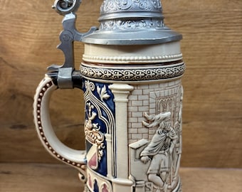 This is an Antique German ceramic beer stein/ mug.