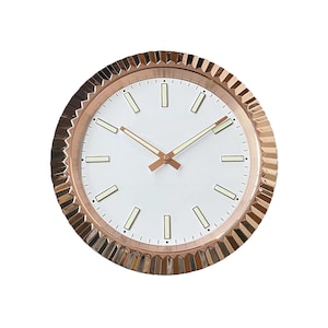 May include: A round wall clock with a white face and gold-coloured hands and markers. The clock has a textured, gold-coloured bezel. The clock's face has a minimalist design, with rectangular markers at each hour.
