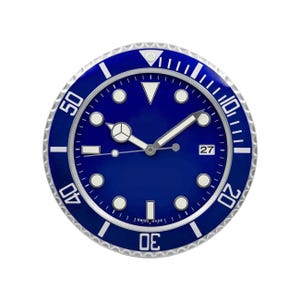 May include: A circular watch face in blue with a silver-coloured bezel. The watch features white hour markers, hands, and a date display at the 3 o'clock position. The text "SWISS MADE" is printed at the bottom.