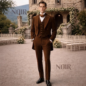 May include: A brown three-piece suit with a long coat, vest, and trousers. The suit is worn with a white dress shirt and a patterned ascot. The word "NOIR" is printed in the upper left and lower right corners of the image.