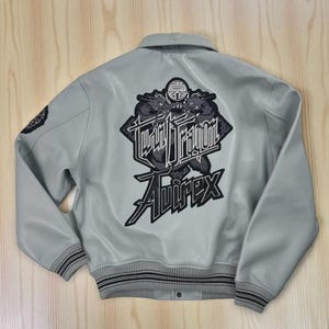 Men’s Avirex style cowhide leather bomber jacket with Twin Dragon embroidery, varsity bomber design in black