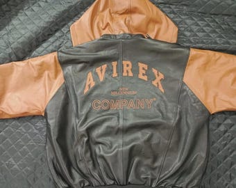 Jaqueta de couro vintage Avirex, modelo Millennium Company, com capuz, preta e marrom, nova com etiqueta.